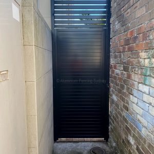 Aluminium Fencing Sydney horizontal slat gate no gaps with 20mm gap panel on top